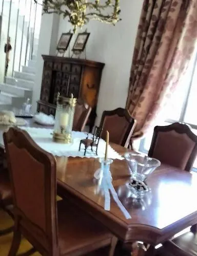 By The River Near Meteora Vilă *